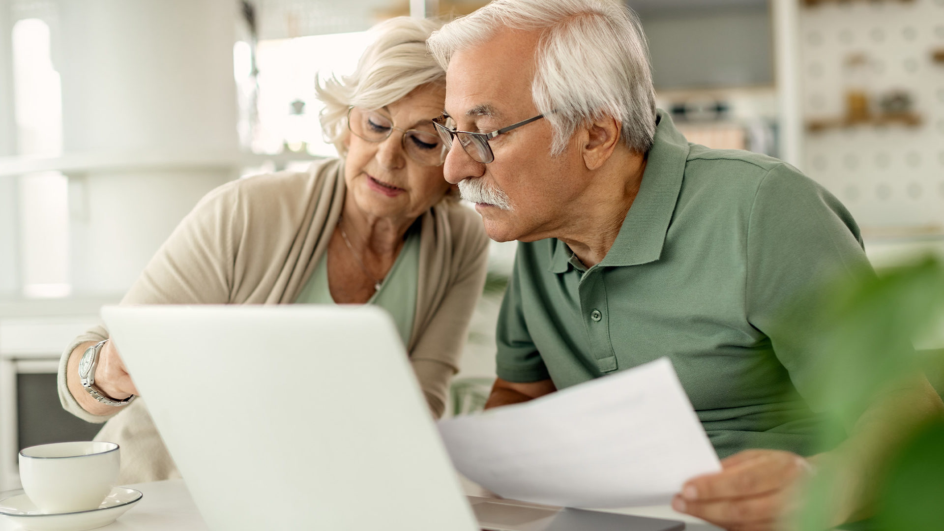 Older couple looking through documents together.