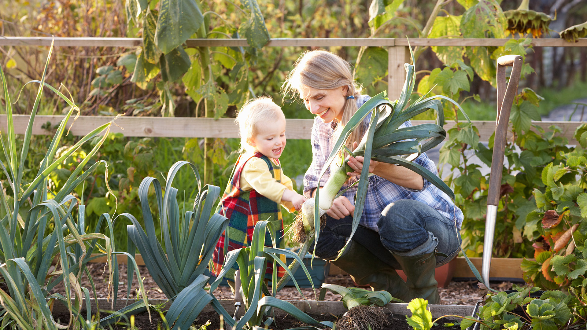 Older woman and their grandchild gardening.