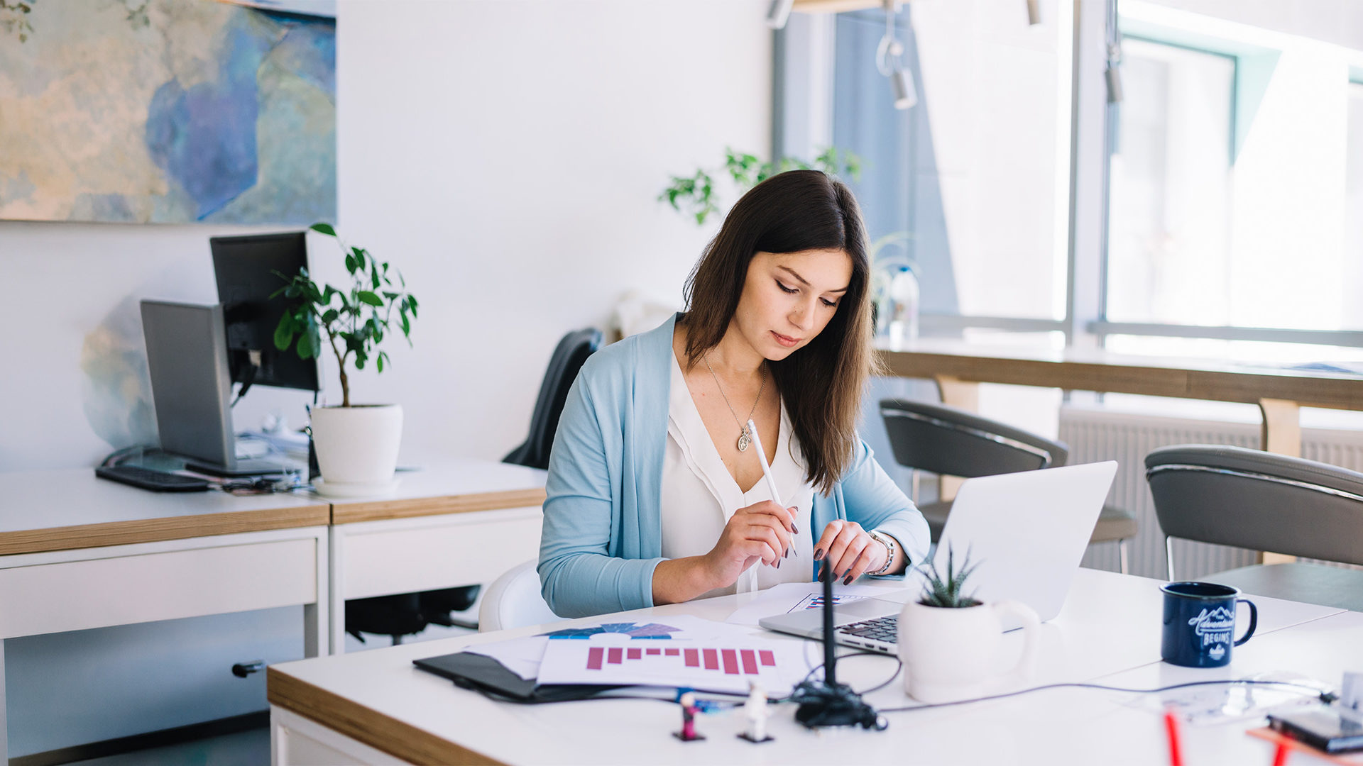 Woman sitting at desk working.