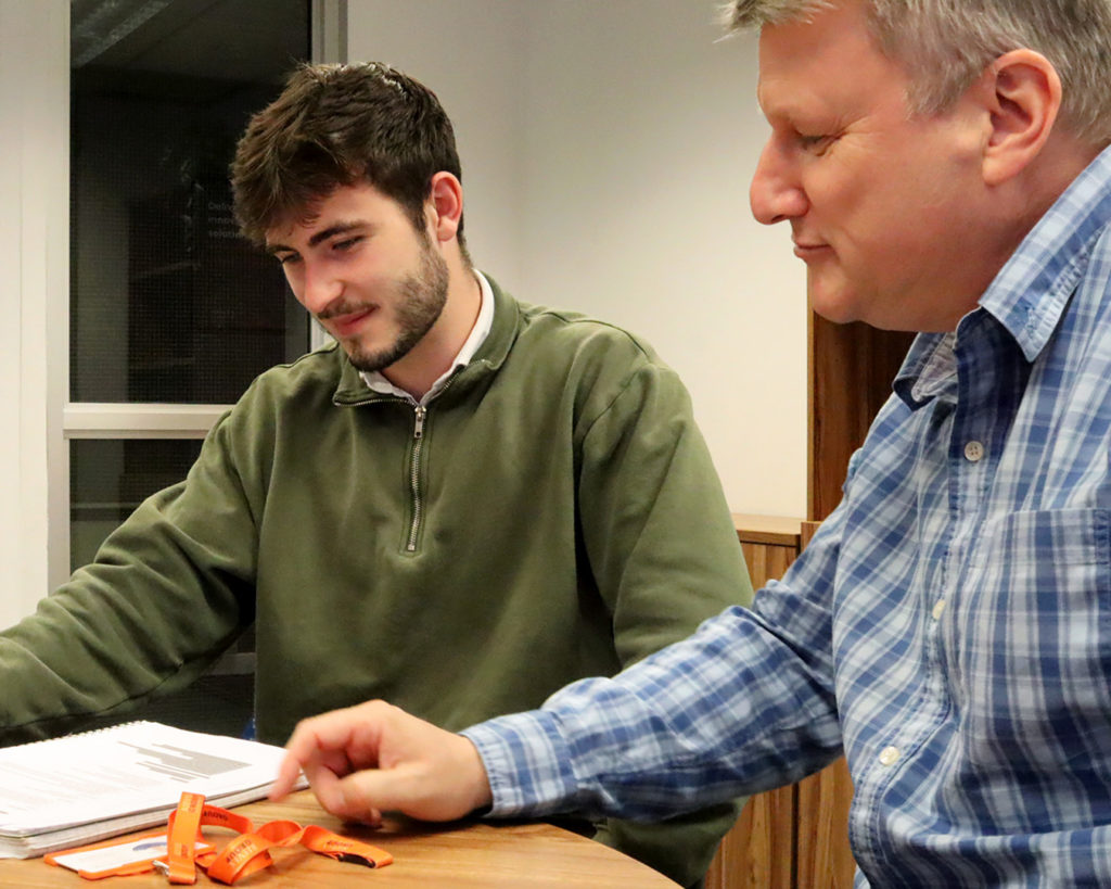 Reeves member of staff sitting down with a client for a pension review meeting.