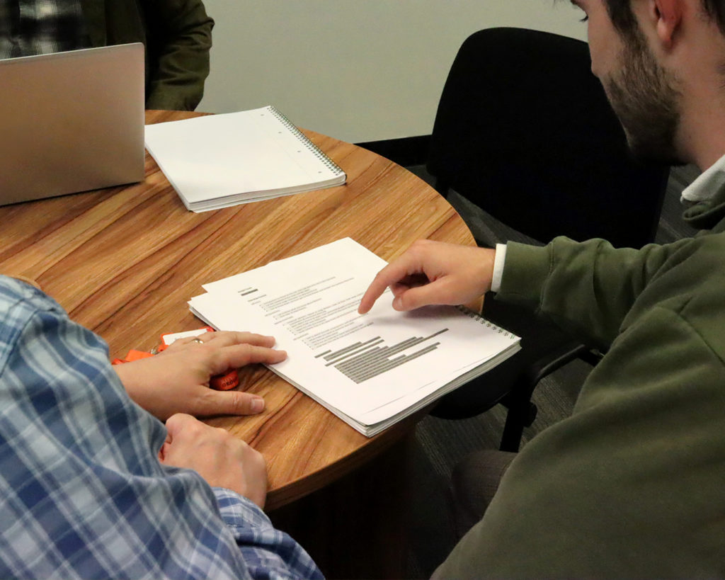 Reeves member of staff sitting down with a client for a pension review meeting.