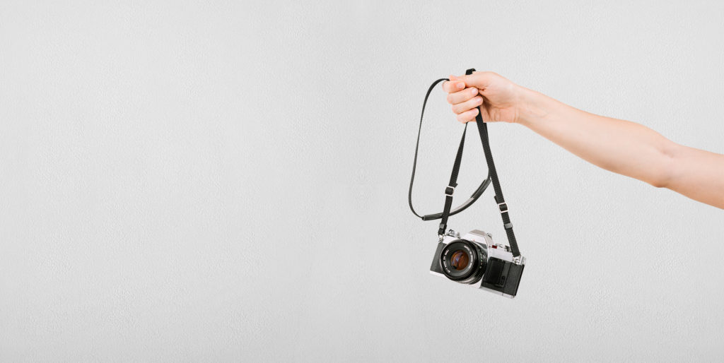 Hand holding a camera.
