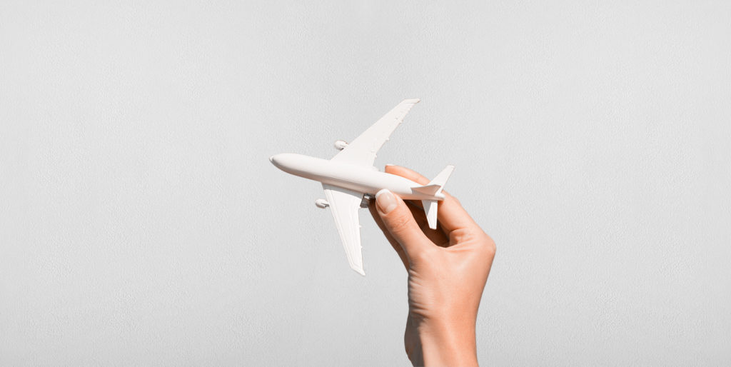 Hand holding an aeroplane.