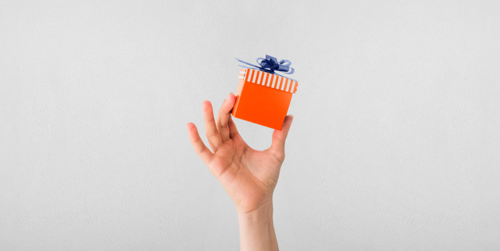 Hand holding a gift.