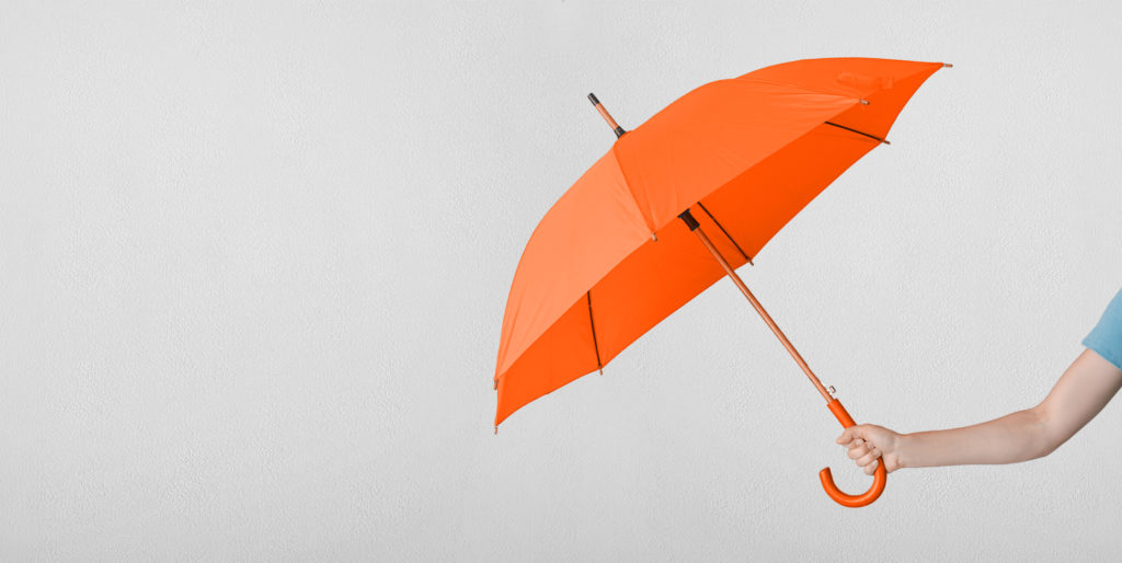 Hand holding umbrella